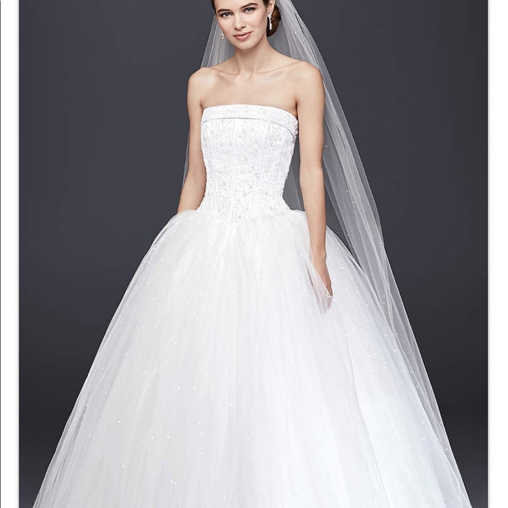 Unaltered tulle wedding dress with beading!